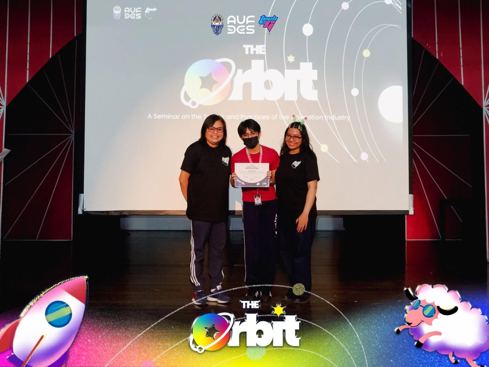 Students receiving recognition on an event stage